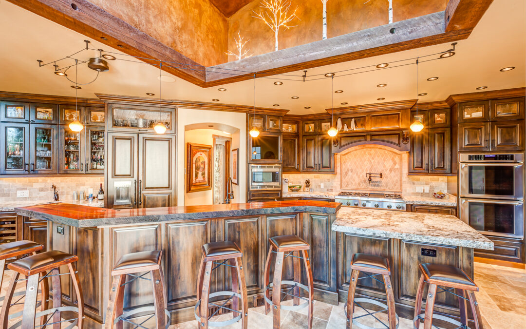 A kitchen with wooden cabinets and stools in it