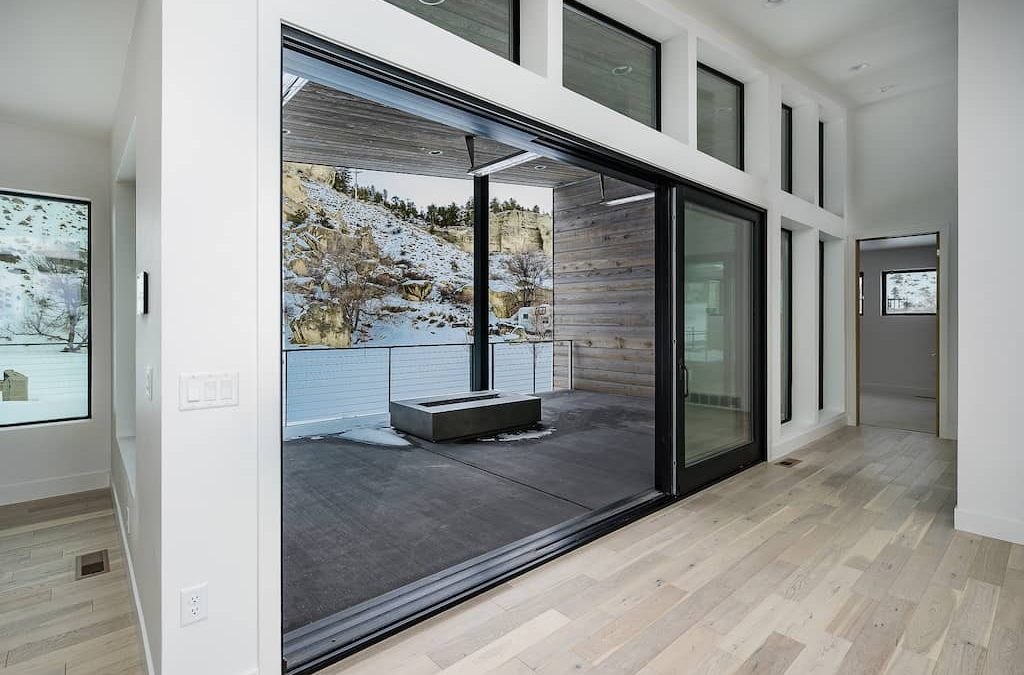 A large sliding glass door in the middle of a room.