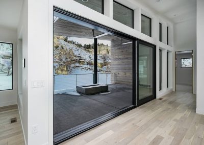 A large sliding glass door in the middle of a room.