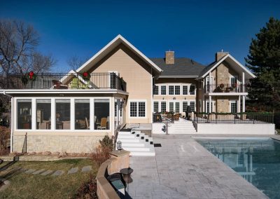 A large house with a pool and patio area.