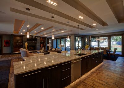 A large kitchen with lots of counter space and lighting.