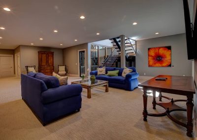 A living room with couches and tables in it