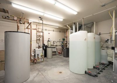 A room filled with many different types of water heaters.
