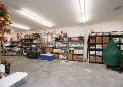 A garage with many boxes and shelves in it